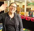 Librarian Deborah waving "Hola!"