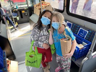 two girls on the book bus