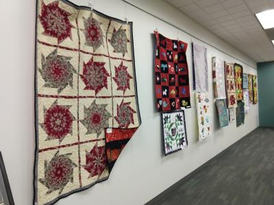 Art Gallery wall with quilts displayed