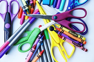 craft supplies of crayons and scissors