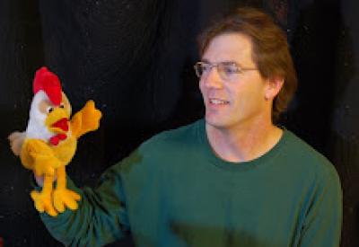 Steven Engelfried with rooster puppet